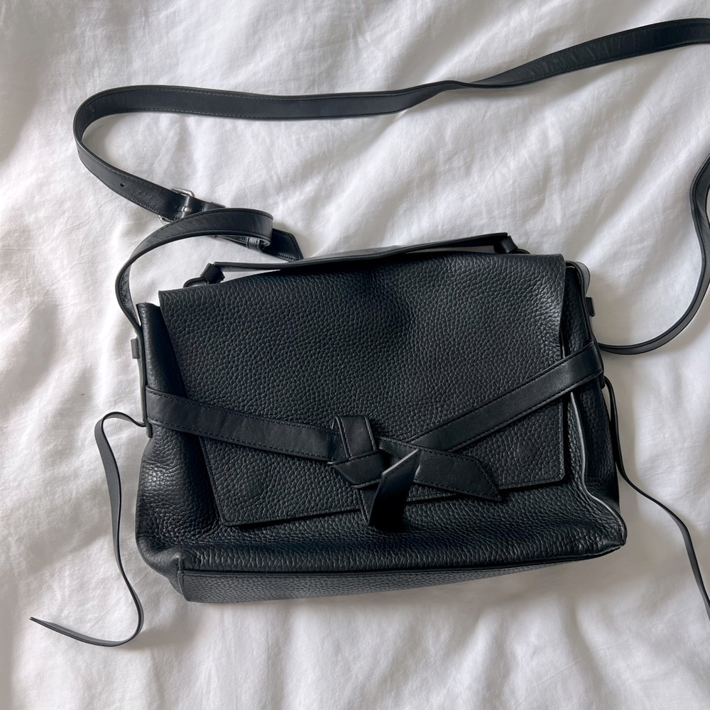 AllSaints Black leather crossbody snap purse. Moderate wear, good condition.